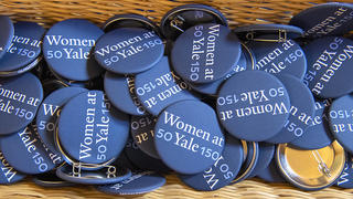 A collection of 50WomenATYale150 buttons